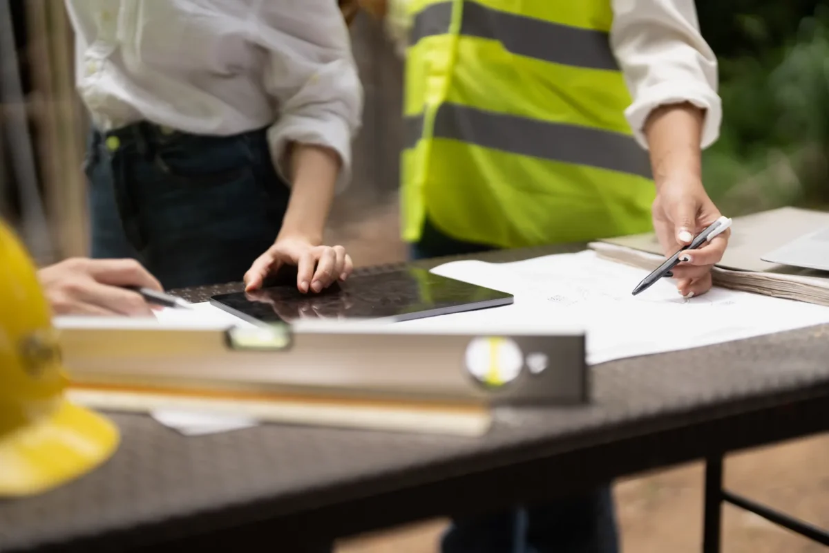 Professionals review plans for deploying an all-in-one energy storage system.