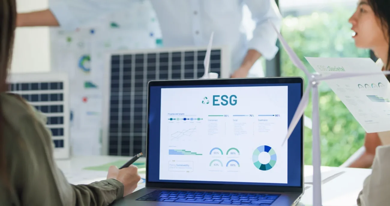 Team analyzing sustainability and ESG data for wholesale solar inverter business planning.