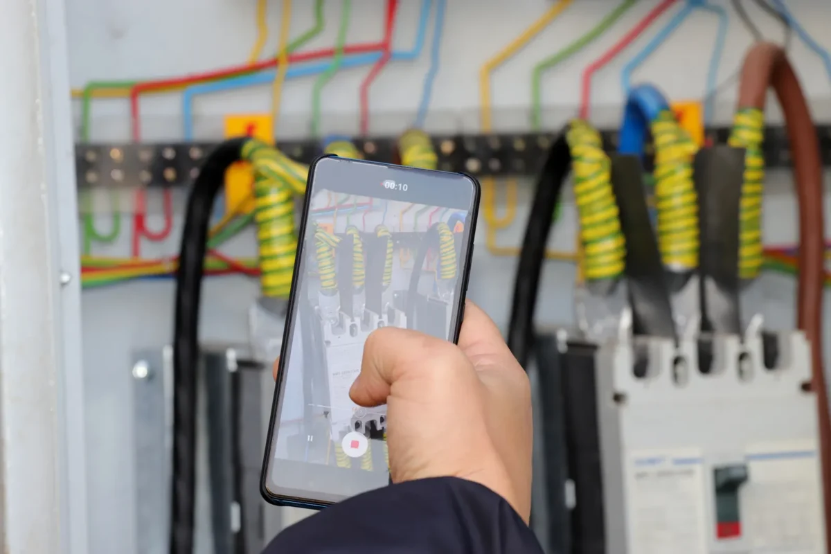 A technician inspects electrical components related to residential PV inverter bulk supply.