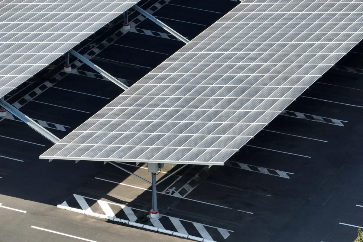 Solar carport panels provide renewable power for commercial data centers.
