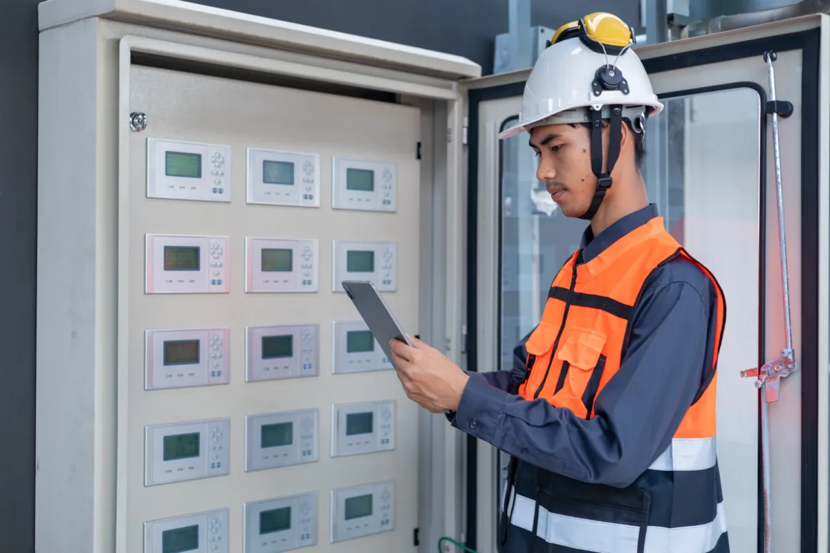 A technician monitors solar-powered systems for B2B data center use.